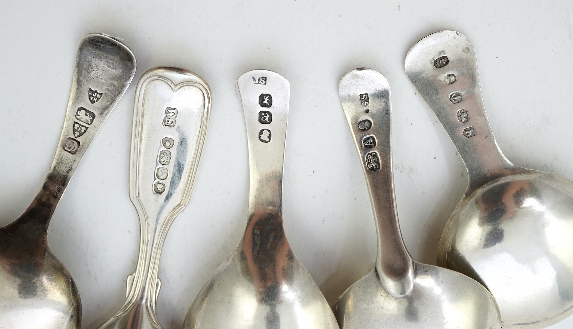 Ten assorted mainly 19th century silver caddy spoons, including seven Old English pattern, one fiddle pattern, one fiddle and thread pattern and one fiddle and shell pattern